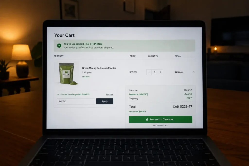 Laptop displaying online shopping cart for Green Maeng Da Kratom Powder 1 kg bags quantity three with SAVE15 discount free shipping and CAD total